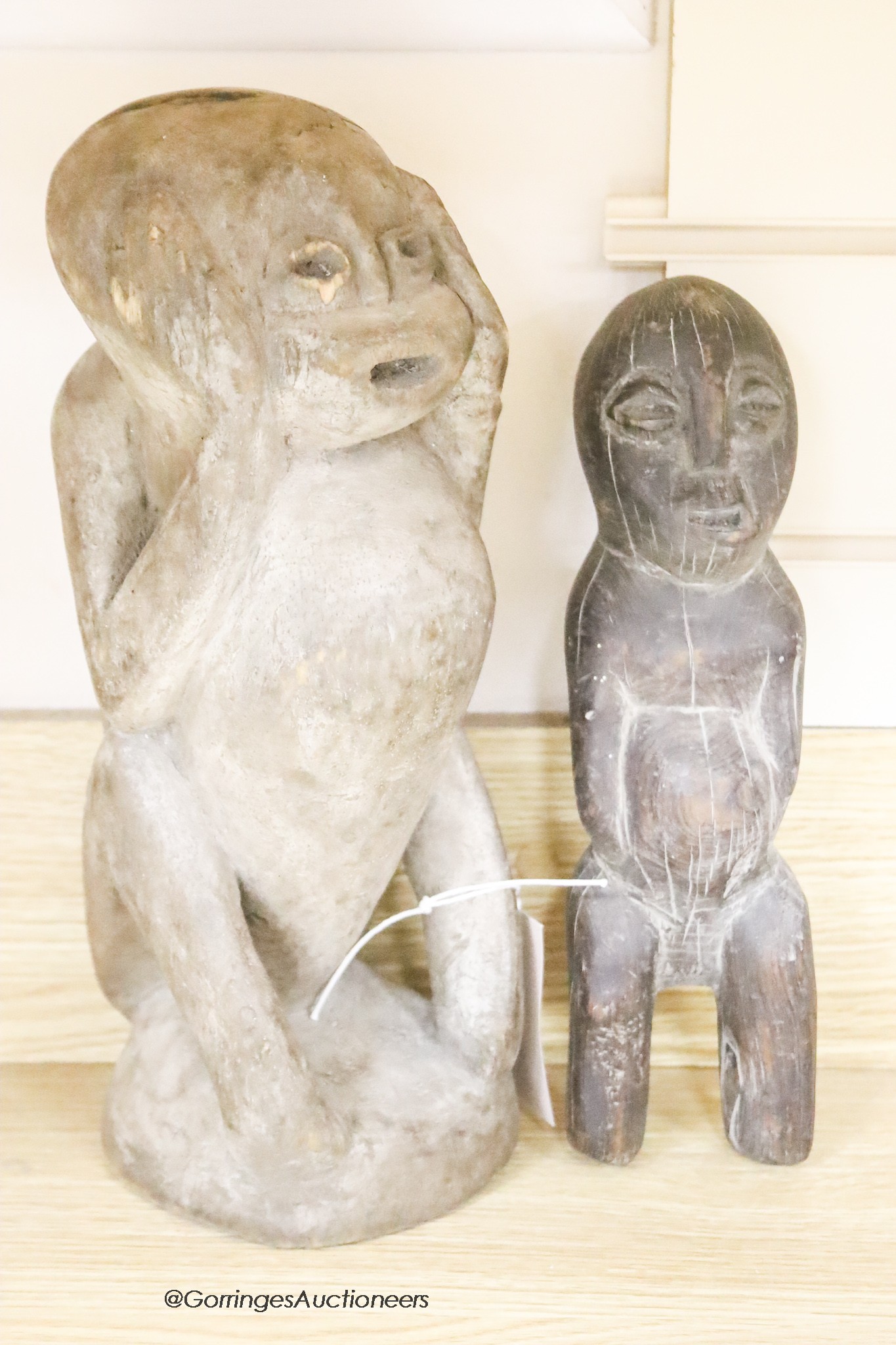 Two carved wood tribal figures, tallest 33 cm